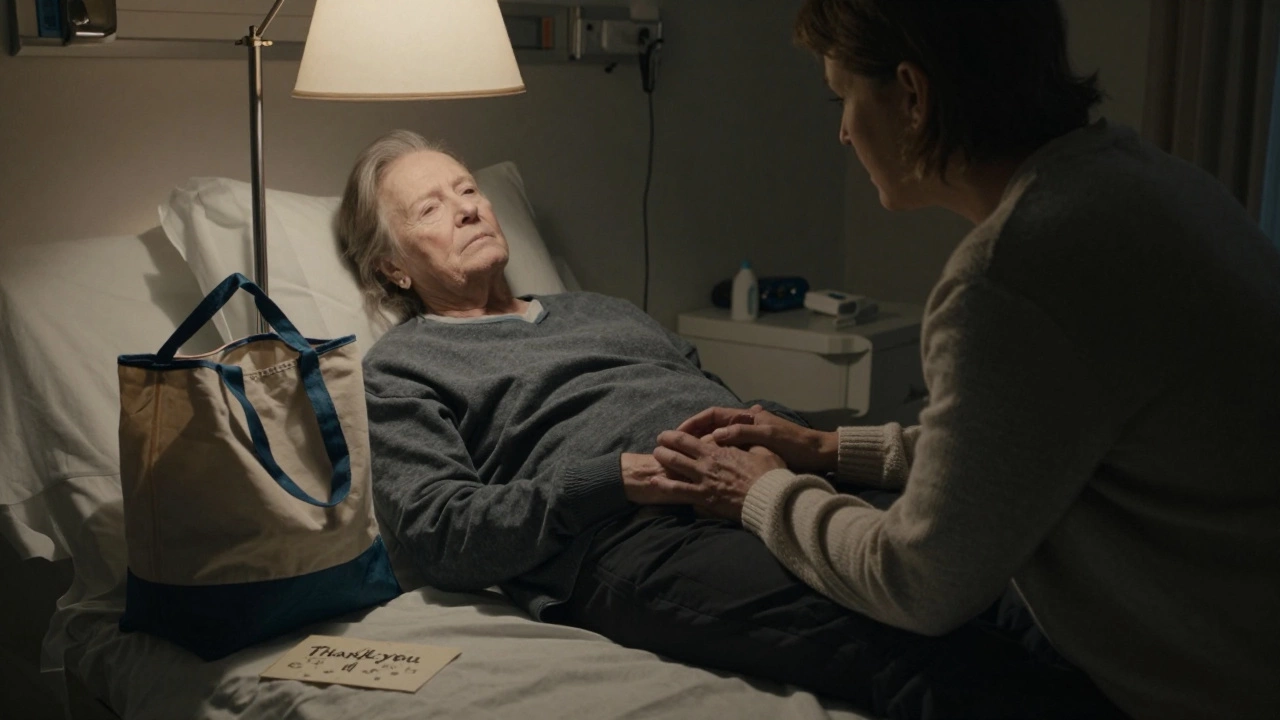 A volunteer holds the hand of a patient in a quiet hospice room, lit by a bedside lamp, with a forgotten thank-you card on the floor.