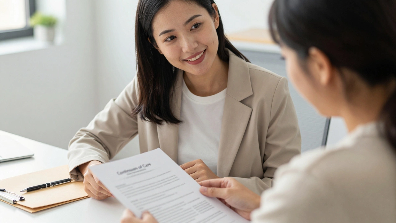 A case worker helping a client review documents in a supportive office setting.